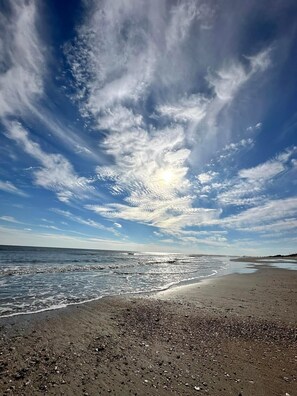 On the beach, sun loungers, beach towels