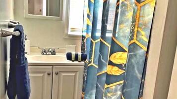 Combined shower/tub, hair dryer, towels, soap