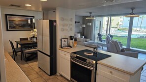 Fridge, microwave, oven, stovetop - Direct Oceanfront Condo Ground Floor Steps to Sand and Pools (New Smyrna Beach)