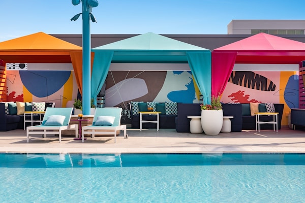 Outdoor pool, open 8:00 AM to 10:00 PM, pool loungers