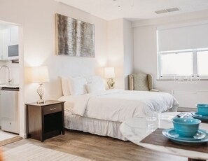 1 bedroom, desk, iron/ironing board, travel crib