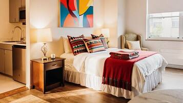 1 bedroom, desk, iron/ironing board, travel crib