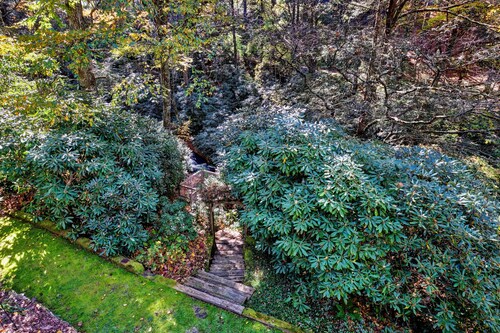 Waterfall Bungalow: Quaint Cottage on Mill Creek w/ Deck | Walk to Downtown