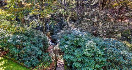 Waterfall Bungalow: Quaint Cottage on Mill Creek w/ Deck | Walk to Downtown