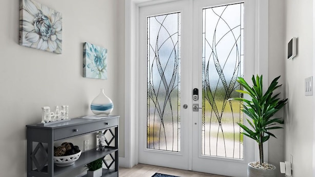 A modern entryway with a grey console, a potted plant, and a large window with decorative glass. - Luxurious retreat on Marco Island  (Marco Island)