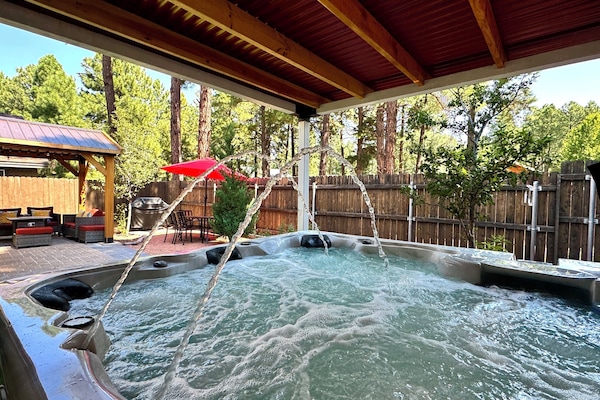 All-weather 6-7 person outdoor hot tub.