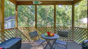 A covered outdoor area with a table and chairs, a grill, and a storage box. - Pool, Trail Access! Dog-Friendly Ocean Pines Haven (Ocean Pines)
