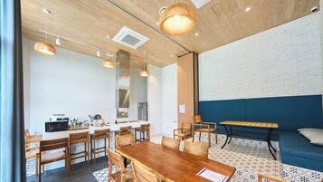 A modern kitchen with a microwave, sink, and stainless steel refrigerator.