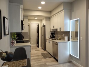 Fridge, microwave, oven, dishwasher - Newly built and tastefully furnished legal one bedroom private guest suit. (Calgary)