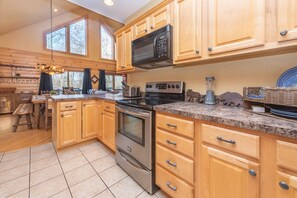 Fridge, microwave, oven, stovetop - Stylish Cabin Escape w/ Hot Tub & Game Room (Oakland)