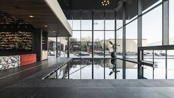 Indoor pool, outdoor pool, pool umbrellas, sun loungers