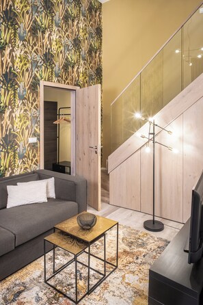 Apartamento, 1 habitación | Zona de estar | Una televisión de pantalla plana