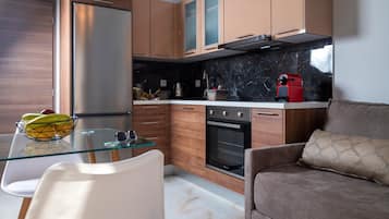 Deluxe Apartment | Private kitchen | Full-sized fridge, oven, stovetop, espresso maker