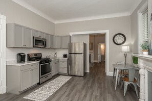 Fridge, microwave, oven, dining tables