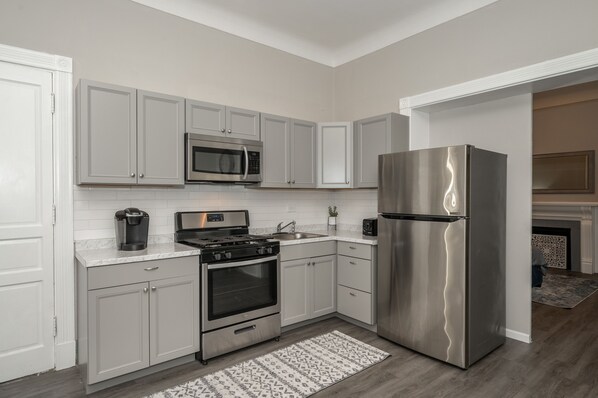 Fridge, microwave, oven, dining tables