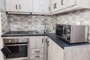 Deluxe-Vierbettzimmer | Eigene Küche | Kühlschrank, Wasserkocher mit Kaffee-/Teezubehör