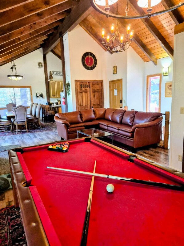 Large open living area with lots of seating facing views.