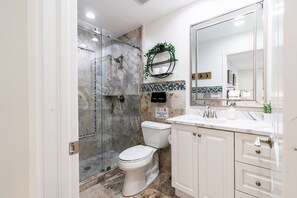 Combined shower/tub, hair dryer, towels, soap