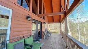 A wooden deck with outdoor seating and a covered area. - 'Sunrise in the Smokies' - Where Mornings Begin Best (Bryson City)