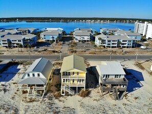 A coastal hotel with multiple buildings, a beach view, and a parking area. - July Dates Discounted! Beachfront w/ 2 living areas (Gulf Shores)