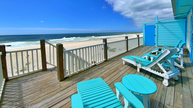 A wooden deck with a view of the beach and ocean. - Beachfront & Dog Friendly! (Gulf Shores)