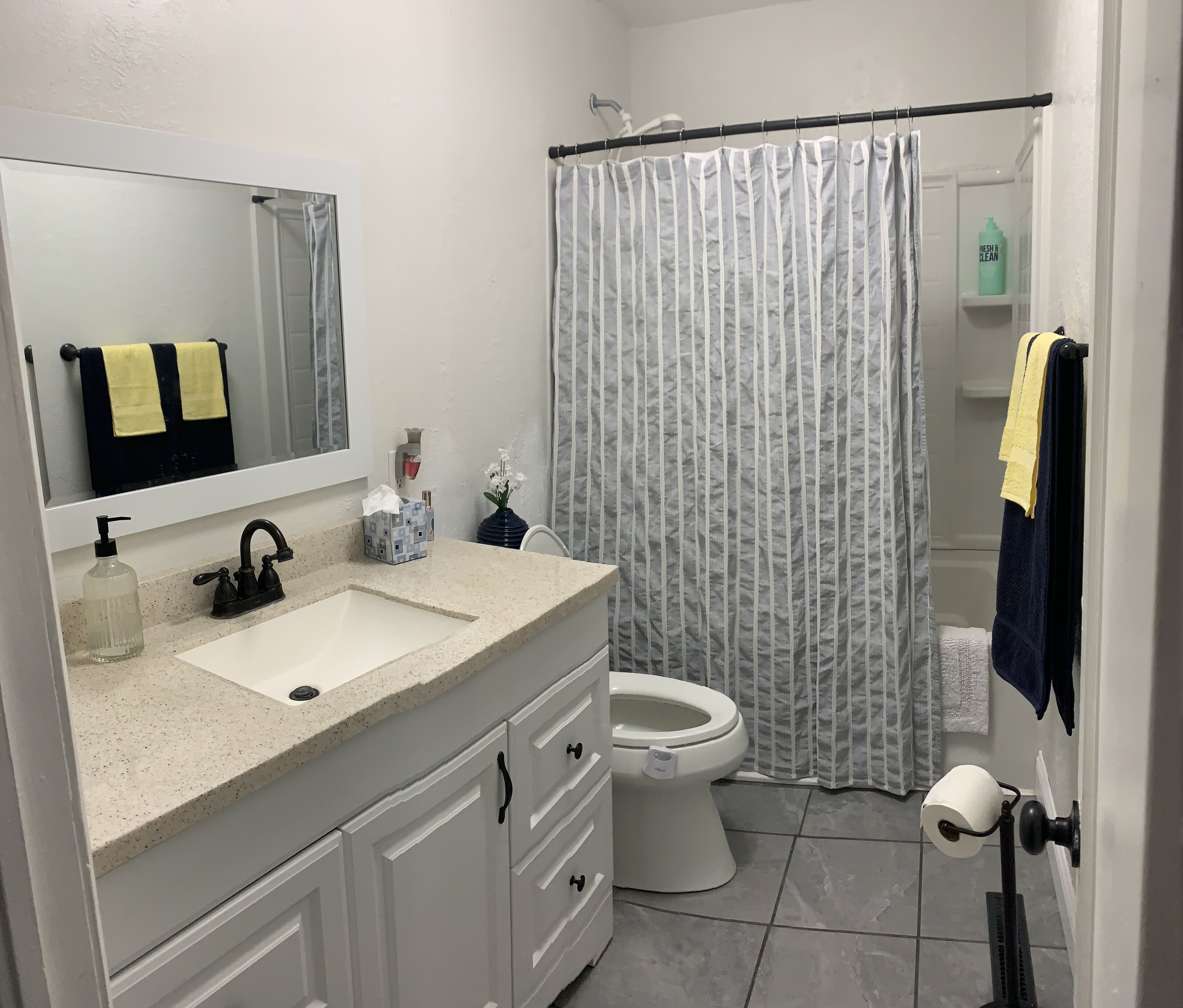 Combined shower/bathtub, towels, soap, toilet paper