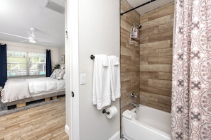 Bathtub, hair dryer, towels, soap