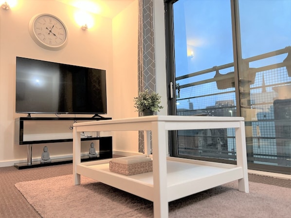 City Apartment, 2 Bedrooms | Living area | 55-inch LED TV with cable channels, TV, Netflix
