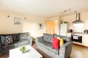 City Apartment, 2 Bedrooms | Living area | 55-inch LED TV with cable channels, TV, Netflix