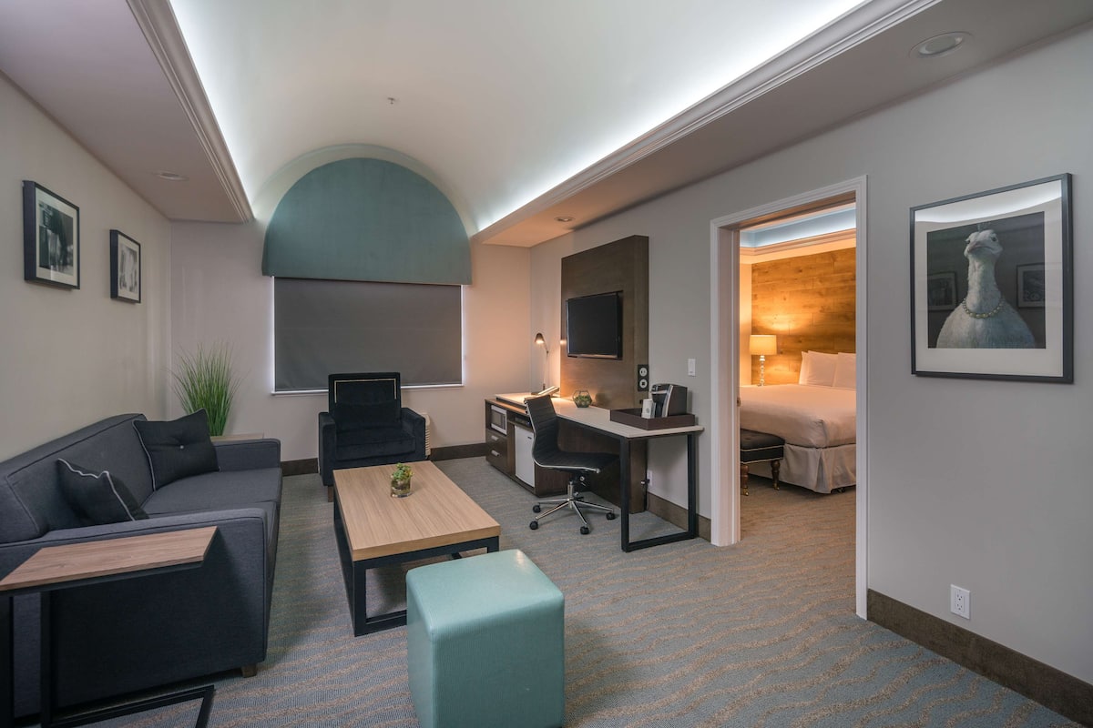 Suite, 1 King Bed, Non Smoking (Dining Table;Living Room) | 1 bedroom, memory foam beds, individually decorated