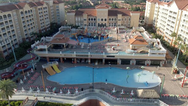 A hotel with a large pool, multiple dining areas, and a water park. - Westgate Orlando Deluxe Villa, 4 Bedroom, 16 max occupancy (Kissimmee)