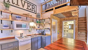 A compact kitchen with a wooden countertop, a microwave, a stove, and a sink. - Updated Mtn View Studio w/ Loft - Near River! (Mountain View)