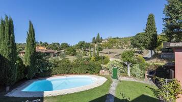 A heated pool, sun loungers