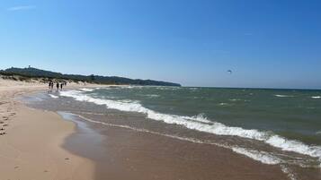 On the beach, sun loungers, beach towels