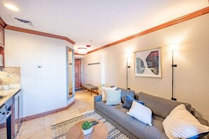 A modern living room with a sofa, a coffee table, and a painting on the wall. - Westgate 4409 AB (Park City)