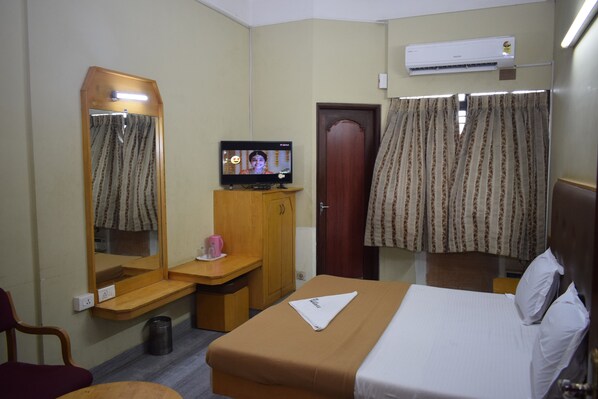 Deluxe Room (AC) | Premium bedding, free WiFi, bed sheets