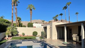 A swimming pool with a patio area, palm trees, and a barbecue grill. - Gorgeous Contemporary Palm Desert Home.  Ask about March - April discount!! (Palm Desert)