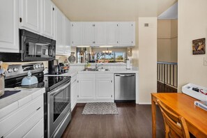 Fridge, microwave, oven, stovetop - 2BR Condo with Views Near Shops & Food + Fast WiFi (Carlsbad)