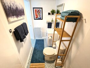 Shower, hair dryer, towels, soap