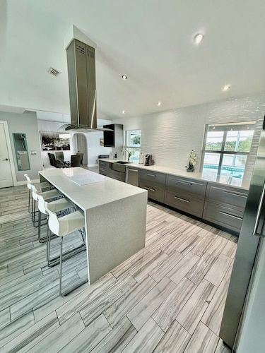 Escape to Paradise!Luxury Waterfront Heated Pool House with Game Room and Piano!