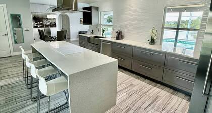 Escape to Paradise!Luxury Waterfront Heated Pool House with Game Room and Piano!