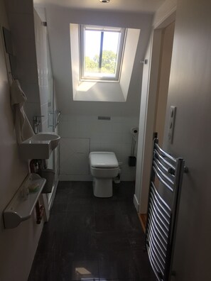 Bathtub, hair dryer, towels, soap
