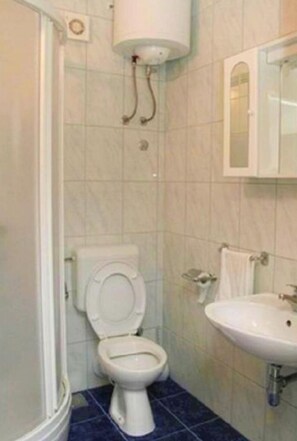 A bathroom with a toilet, sink, and shower. - Beautiful Apartment With Sea View, Trogir, Croatia (Trogir)