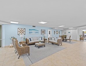 Relax in this inviting living area with a sofa, chairs, and dining table.