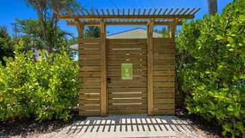 A wooden gate with a sign indicating it is private property.