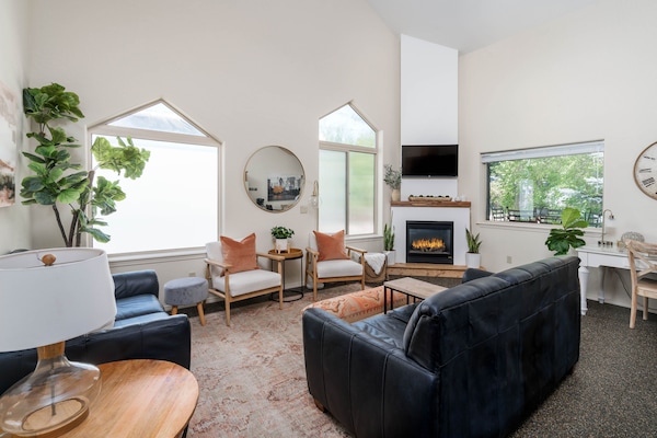 Dreamy in a big, lovely way including gas fireplace, ceiling fan & cozy throws