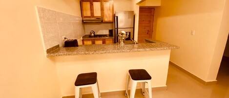 Fridge, microwave, stovetop, coffee/tea maker