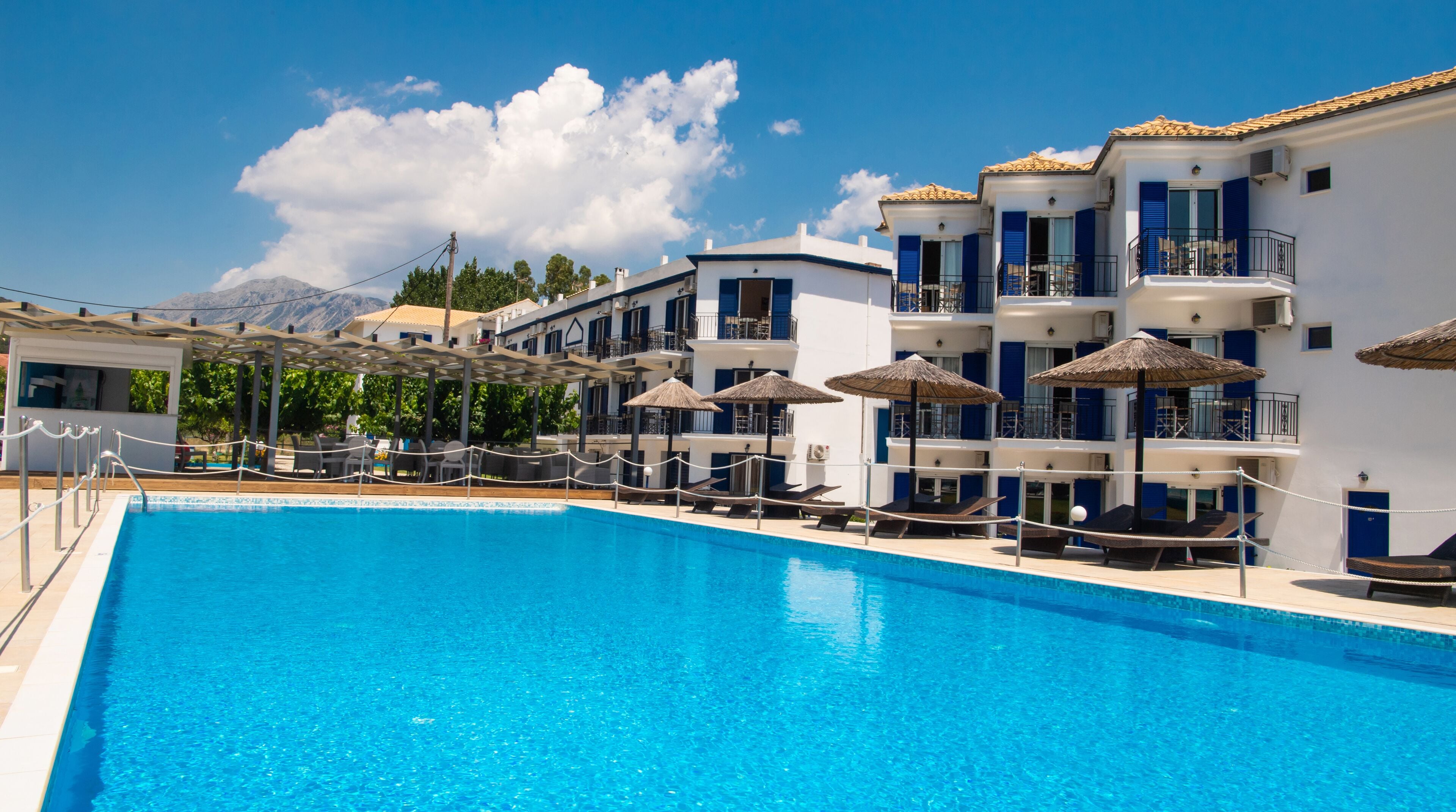Seasonal outdoor pool, open 9:00 AM to 8:00 PM, pool umbrellas