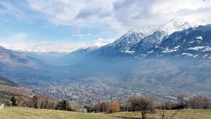 A panoramic view of a valley with a town, snow-capped mountains, and a clear sky. - 2 bedroom lovely apartment in Chatillon (Chatillon)