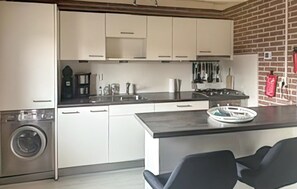 Fridge, stovetop, dishwasher, coffee/tea maker